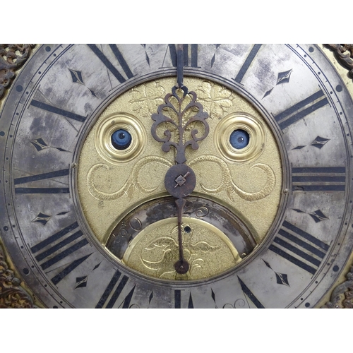 1391A - Henry South : An 18thC oak cased longcase clock, the brass dial with automaton eyes, silvered chapte... 