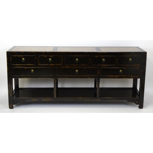 1459 - A 20thC Chinese Ming style sideboard with three hardstone panels to the top, the base having eight s... 