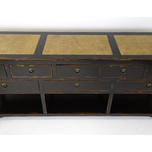 1459 - A 20thC Chinese Ming style sideboard with three hardstone panels to the top, the base having eight s... 