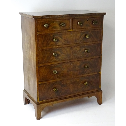 1460 - A 19thC mahogany chest of drawers of large proportions, the chest having a crossbanded top and drawe... 