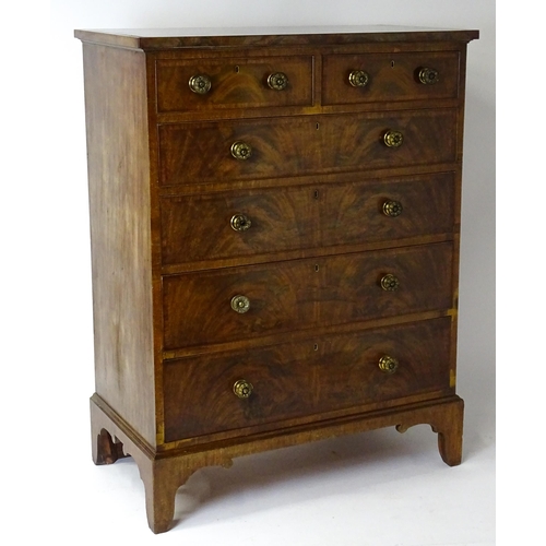 1460 - A 19thC mahogany chest of drawers of large proportions, the chest having a crossbanded top and drawe... 