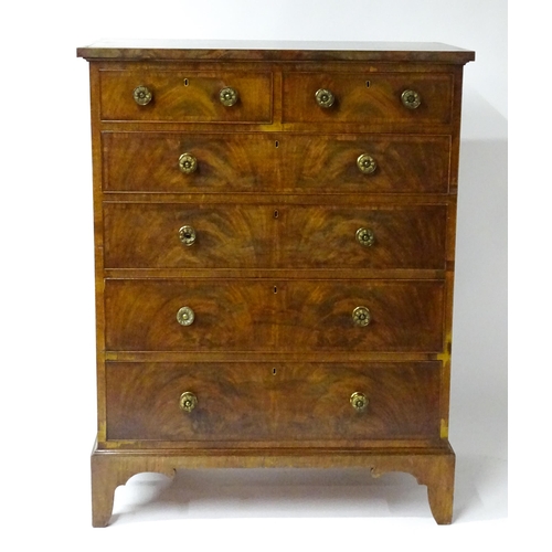 1460 - A 19thC mahogany chest of drawers of large proportions, the chest having a crossbanded top and drawe... 