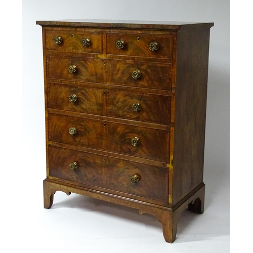 1460 - A 19thC mahogany chest of drawers of large proportions, the chest having a crossbanded top and drawe... 