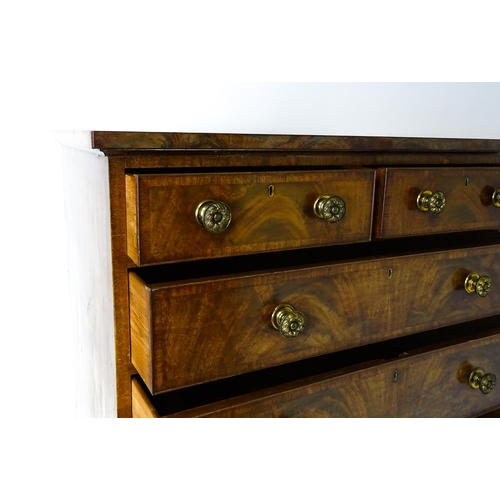 1460 - A 19thC mahogany chest of drawers of large proportions, the chest having a crossbanded top and drawe... 