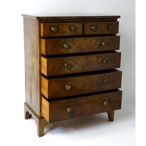 1460 - A 19thC mahogany chest of drawers of large proportions, the chest having a crossbanded top and drawe... 