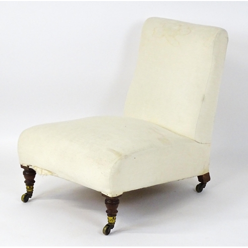 1461 - A mid 19thC Howard & Sons slipper chair raised on four mahogany legs terminating in brass caps (stam... 