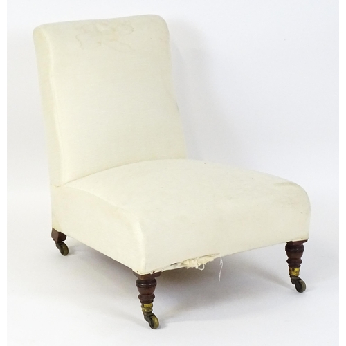 1461 - A mid 19thC Howard & Sons slipper chair raised on four mahogany legs terminating in brass caps (stam... 