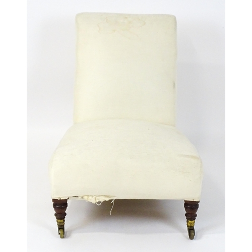 1461 - A mid 19thC Howard & Sons slipper chair raised on four mahogany legs terminating in brass caps (stam... 