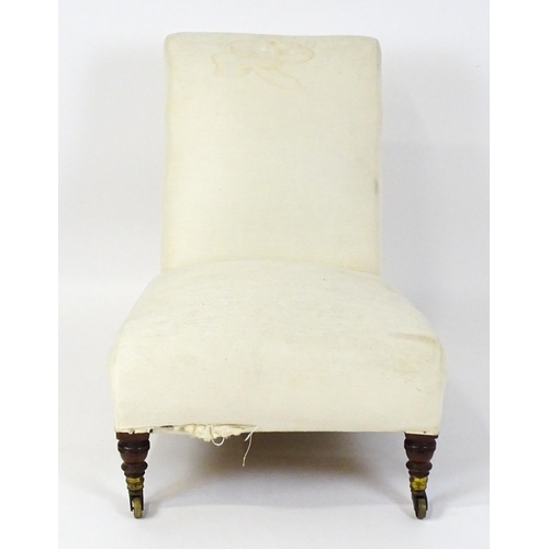 1461 - A mid 19thC Howard & Sons slipper chair raised on four mahogany legs terminating in brass caps (stam... 