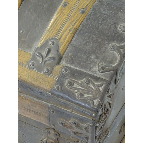 1582 - An early 20thC continental dome top trunk, with fitted interior and applied decorative lining. Appro... 