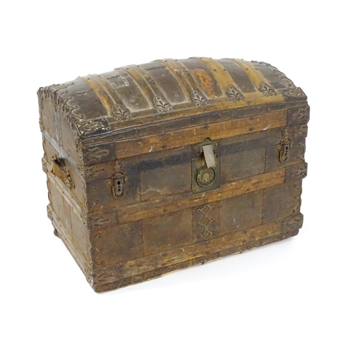 1582 - An early 20thC continental dome top trunk, with fitted interior and applied decorative lining. Appro... 