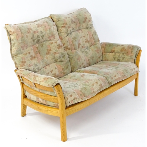 1637 - A modern Ercol three-piece suite, model 930LT, comprising two-seater sofa and two armchairs with gre... 