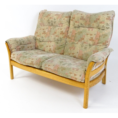 1637 - A modern Ercol three-piece suite, model 930LT, comprising two-seater sofa and two armchairs with gre... 