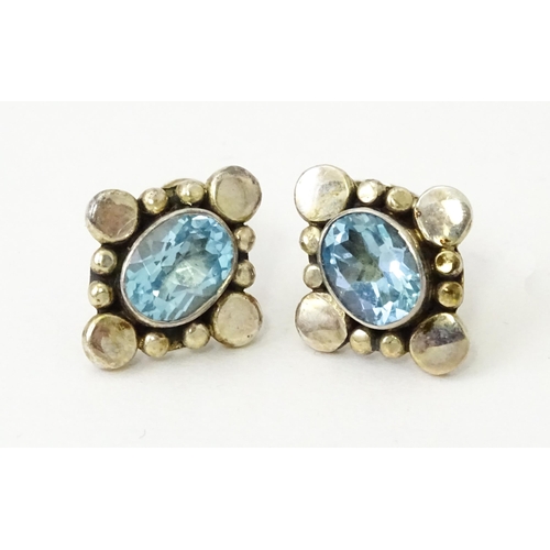 660 - A pair of silver earrings set with blue stones. Together with a single gilt metal drop earring with ... 