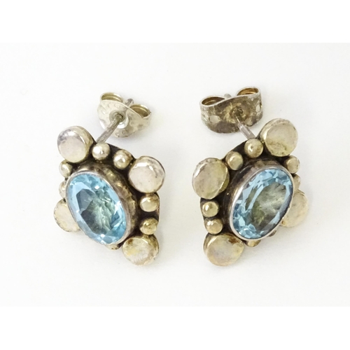 660 - A pair of silver earrings set with blue stones. Together with a single gilt metal drop earring with ... 