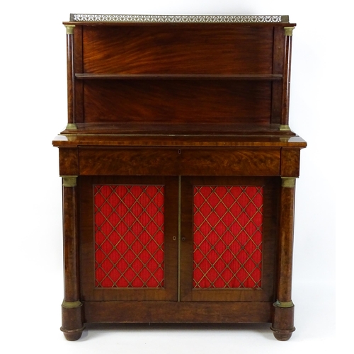 1455 - A 19thC mahogany secretaire desk in the French Empire style, the super structure formed as a bookcas... 