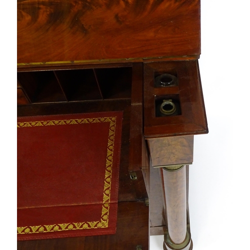 1455 - A 19thC mahogany secretaire desk in the French Empire style, the super structure formed as a bookcas... 