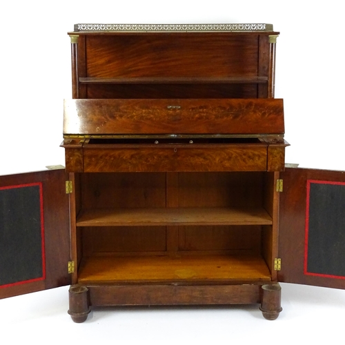 1455 - A 19thC mahogany secretaire desk in the French Empire style, the super structure formed as a bookcas... 