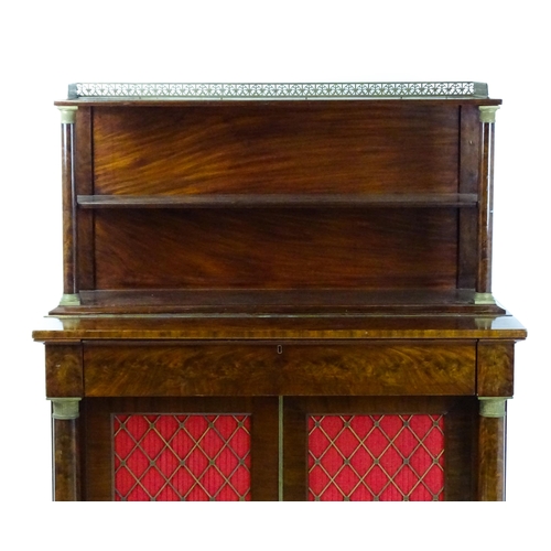 1455 - A 19thC mahogany secretaire desk in the French Empire style, the super structure formed as a bookcas... 