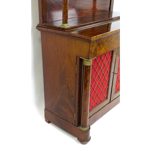 1455 - A 19thC mahogany secretaire desk in the French Empire style, the super structure formed as a bookcas... 