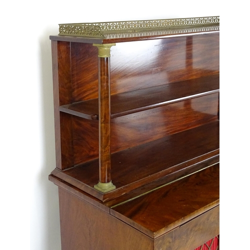 1455 - A 19thC mahogany secretaire desk in the French Empire style, the super structure formed as a bookcas... 