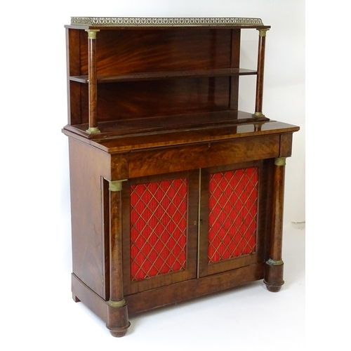 1455 - A 19thC mahogany secretaire desk in the French Empire style, the super structure formed as a bookcas... 