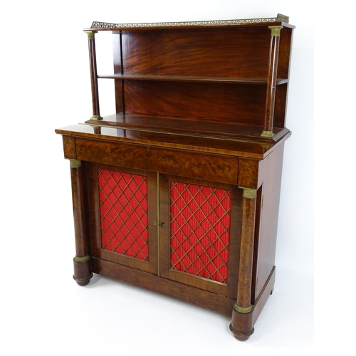 1455 - A 19thC mahogany secretaire desk in the French Empire style, the super structure formed as a bookcas... 