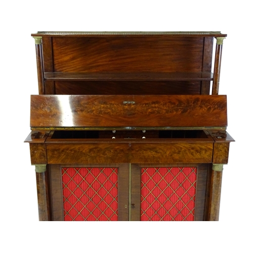 1455 - A 19thC mahogany secretaire desk in the French Empire style, the super structure formed as a bookcas... 