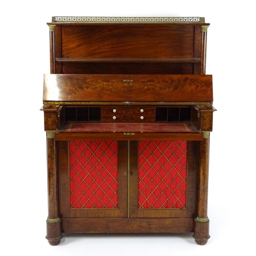 1455 - A 19thC mahogany secretaire desk in the French Empire style, the super structure formed as a bookcas... 