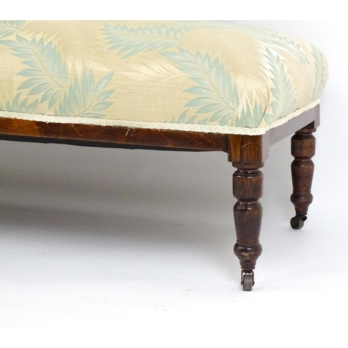 1458 - An early / mid 20thC chaise longue with a scrolled end and upholstered backrest with turned supports... 