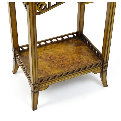 1515 - A late 20thC sewing table with a hinged top opening to show fitted compartments, a mirror, and an ad... 