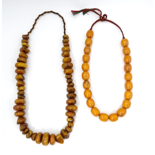 780 - Two vintage bead necklaces of amber coloured beads (2)