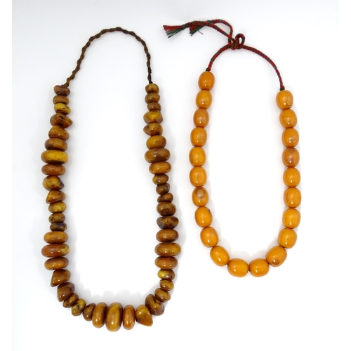 780 - Two vintage bead necklaces of amber coloured beads (2)