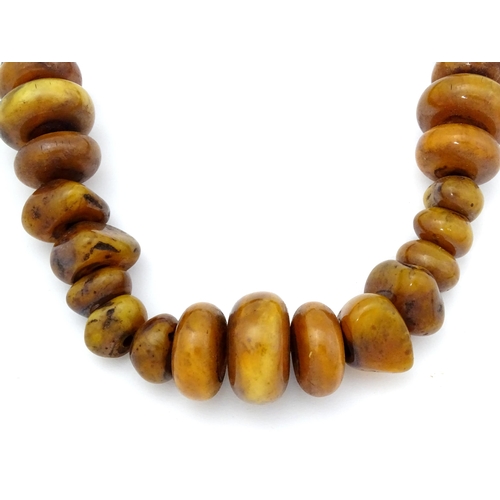 780 - Two vintage bead necklaces of amber coloured beads (2)