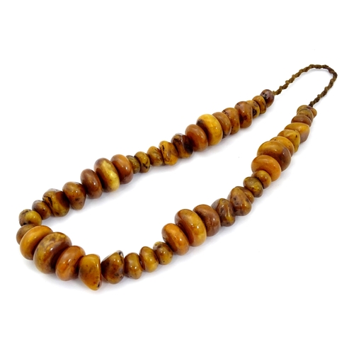 780 - Two vintage bead necklaces of amber coloured beads (2)