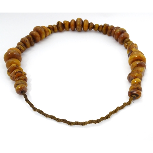 780 - Two vintage bead necklaces of amber coloured beads (2)