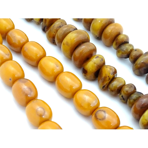 780 - Two vintage bead necklaces of amber coloured beads (2)