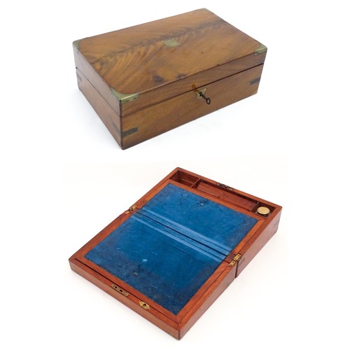 1248 - A 19thC brass bound mahogany writing slope opening to reveal a fitted interior. Approx. 5