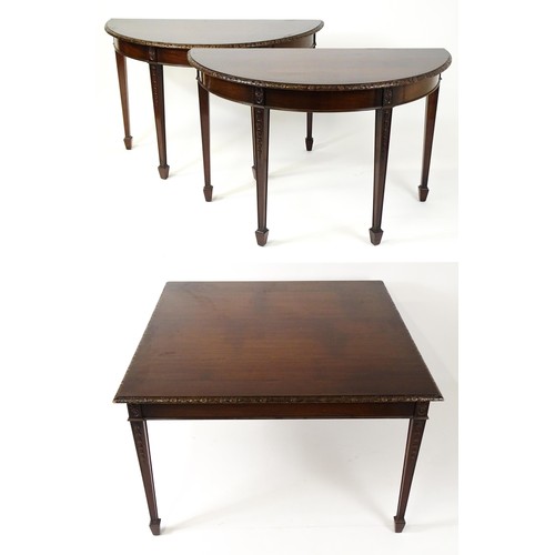 1538 - An early 20thC mahogany Waring and Gillows dining table comprised of two demi lune end tables and a ... 