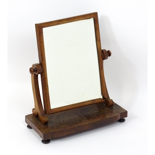 5 - A late 19thC mahogany toilet / dressing mirror with scrolled supports and raised on squat bun feet. ... 