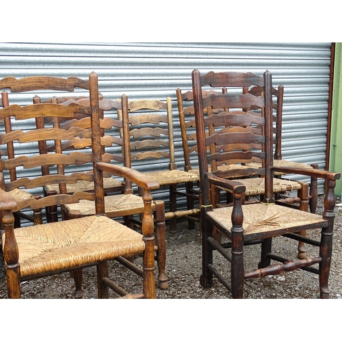 11 - Thirteen assorted 19thC ash and rush seated ladderback dining chairs, to include three carvers, the ... 