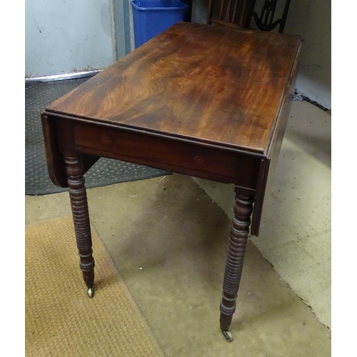 18 - A 19thC mahogany Pembroke table with single drawer, standing on four turned legs, the top approx 44