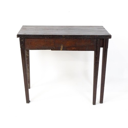 27 - An 18thC mahogany tea table raised on five chamfered tapered legs. 36