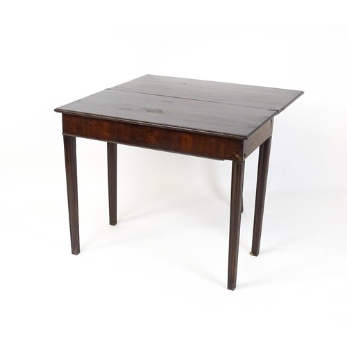 27 - An 18thC mahogany tea table raised on five chamfered tapered legs. 36