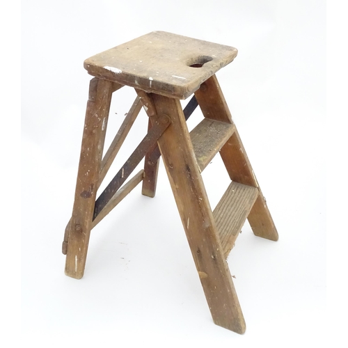 28 - A mid 20thC folding wooden step, constructed from pine with steel braces, approx 23