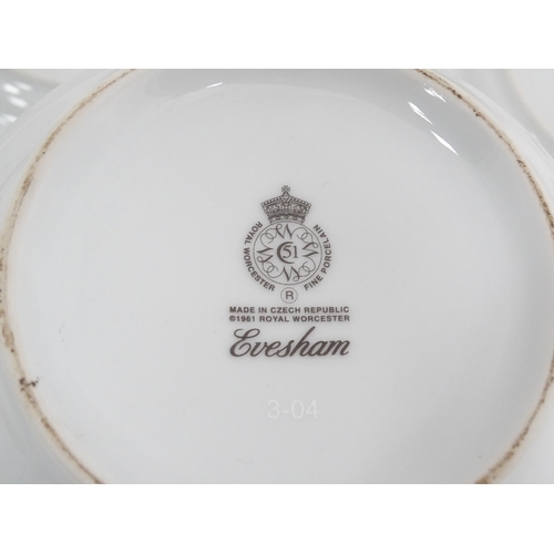 57 - A quantity of Royal Worcester dinner wares in the Evesham pattern to include plates, serving dishes,... 