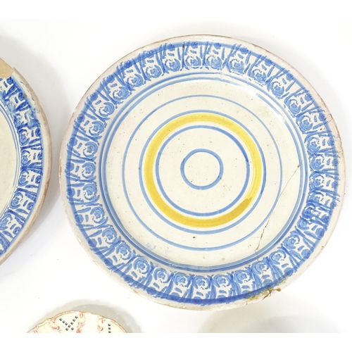 204 - A quantity of assorted ceramics to include two large faience chargers with banded detail, a studio p... 