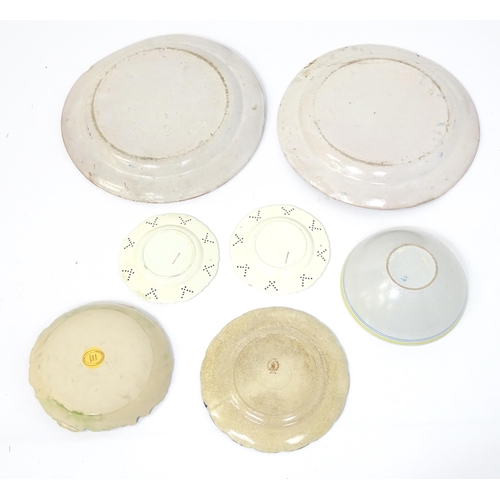 204 - A quantity of assorted ceramics to include two large faience chargers with banded detail, a studio p... 