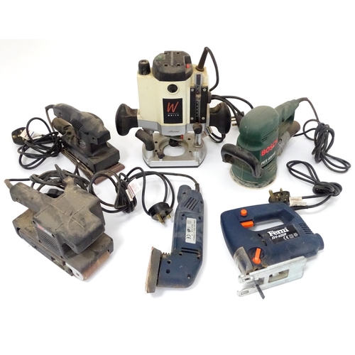 205 - Workshop Tools : a quantity of power tools, to include an Axminster aw-127R router (with manual), a ... 