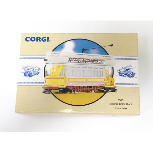 308 - Toys: A Corgi die cast scale model Double Deck Tram Plymouth no. 97269. Together with a Burago Porsc... 